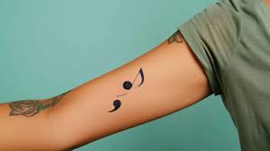 The Semi-Colon Tattoo: A Symbol of Strength, Survival, and Solidarity